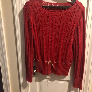 Red sweater with khaki drawstring detail